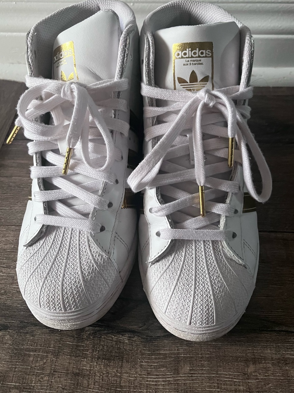 Size 7.5 adidas White superstar Women's High-Top Sneakers with Gold Accents